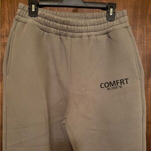 Sweat pants in the color military green.